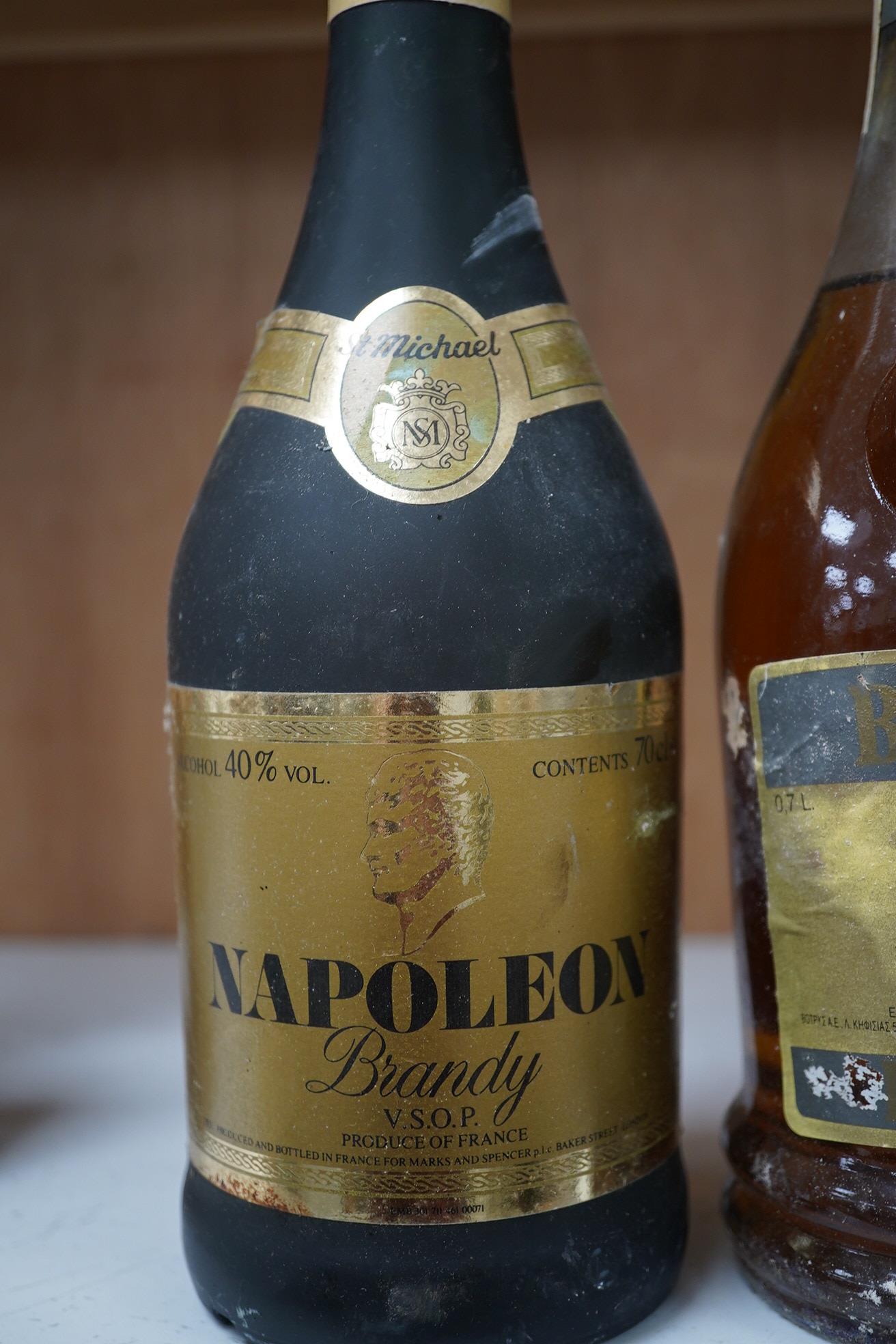 Four bottles of brandy; Napoleon De Luxe VSOP Napoleon Brandy, two bottles, Botrys brandy and another (worn label). Condition - storage unknown